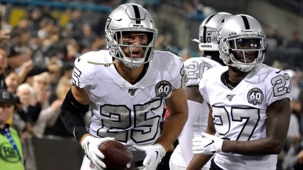 Nov 7, 2019; Oakland, CA, USA; Oakland Raiders free safety Erik Harris (25) celebrates with cornerback Trayvon Mullen (27) after intercepting a pass against the Los Angeles Chargers in the second quarter at Oakland-Alameda County Coliseum. Mandatory Credit: Kirby Lee-USA TODAY Sports